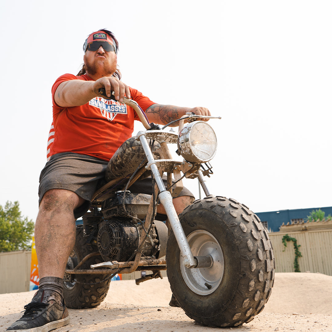 Wide / Smoke | Man on a motorcycle wearing The Big Buck Hunter Original Wide from Pit Viper Sunglasses