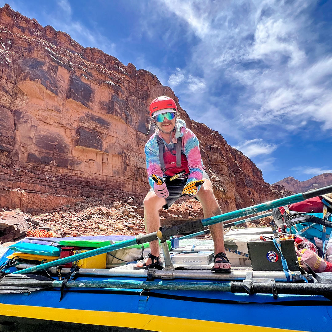 / Blue | Man on a raft wearing Pit Viper Sunglasses