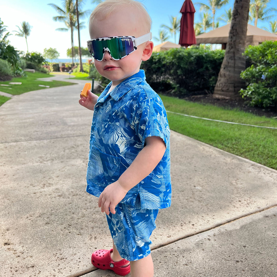 / Blue-Green | Baby holding cheese in The Cowabunga Baby Vipes from Pit Viper Sunglasses