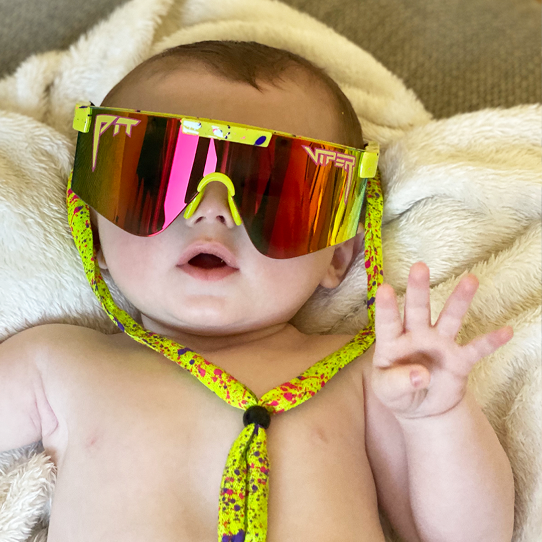 / Z87+ Rainbow | Baby holding up four fingers wearing Pit Viper Sunglasses