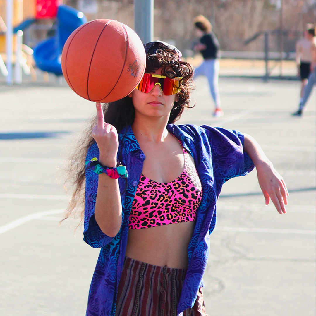 / Polarized Rainbow | Woman twirling basketball wearing Pit Viper Sunglasses