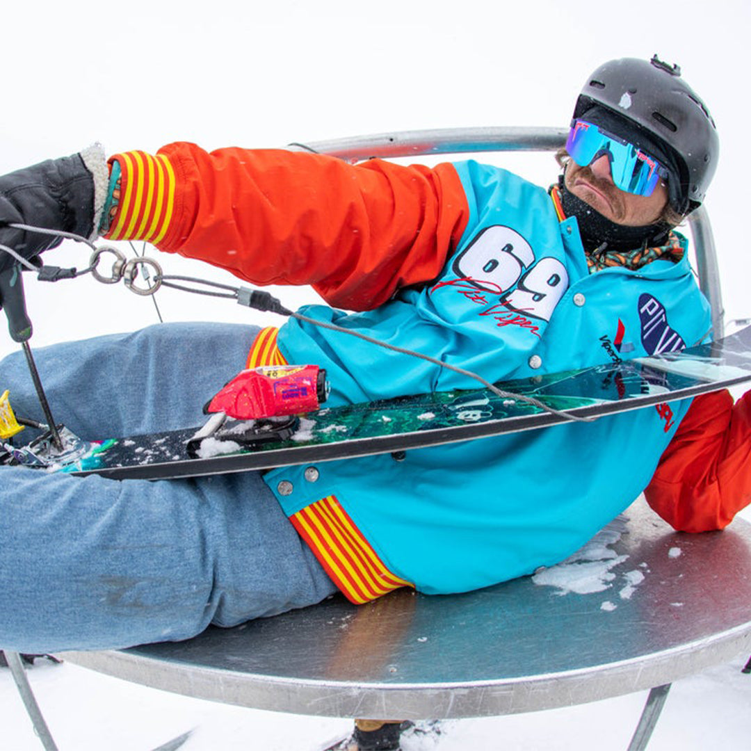 Wide / Polarized Blue | Man posing with skis wearing The Basketball Team Original from Pit Viper Sunglasses