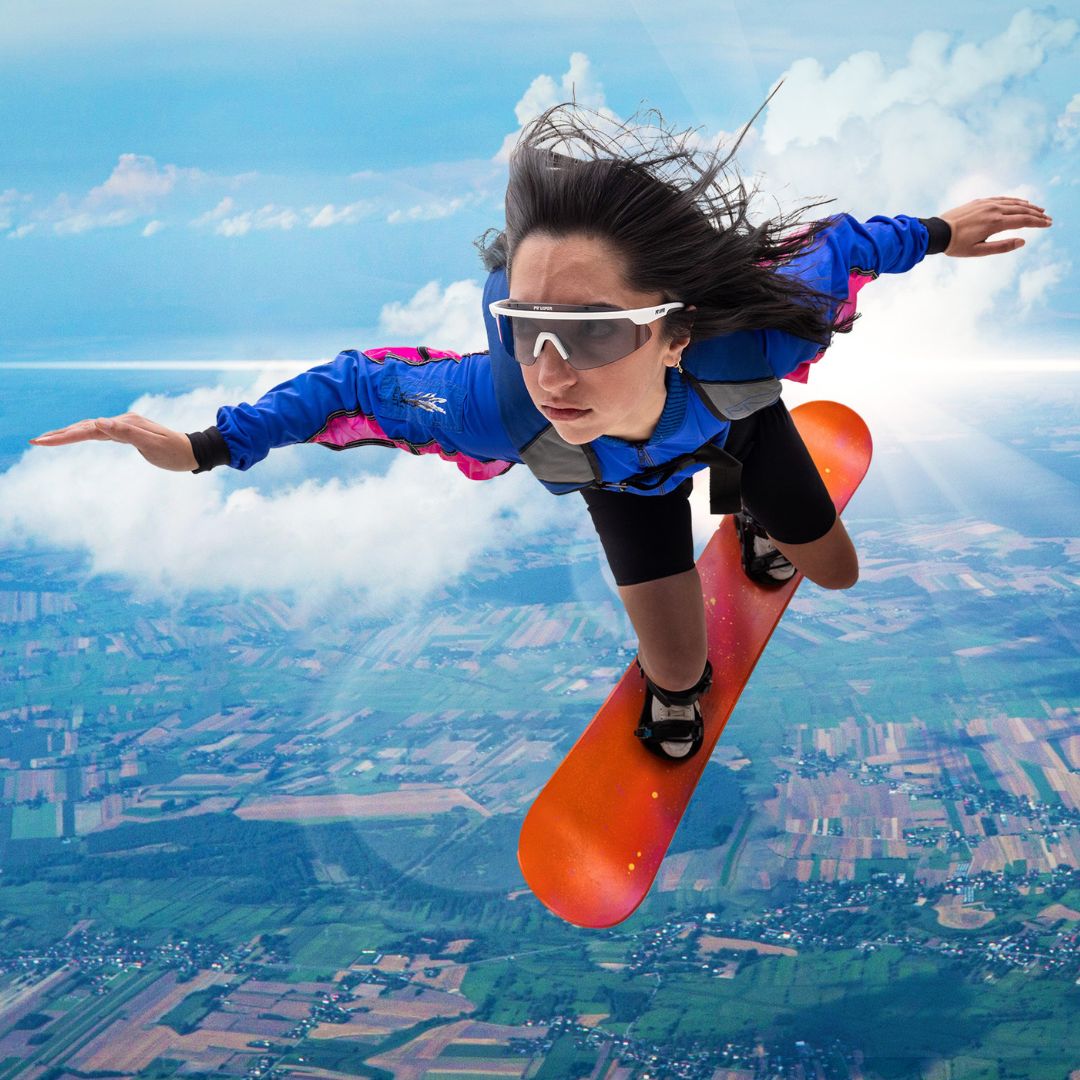 / Photochromic Smoke | Woman pretends to fly wearing The Miami Nights Skysurfer with a Photochromic Smoke lens from Pit Viper Sunglasses