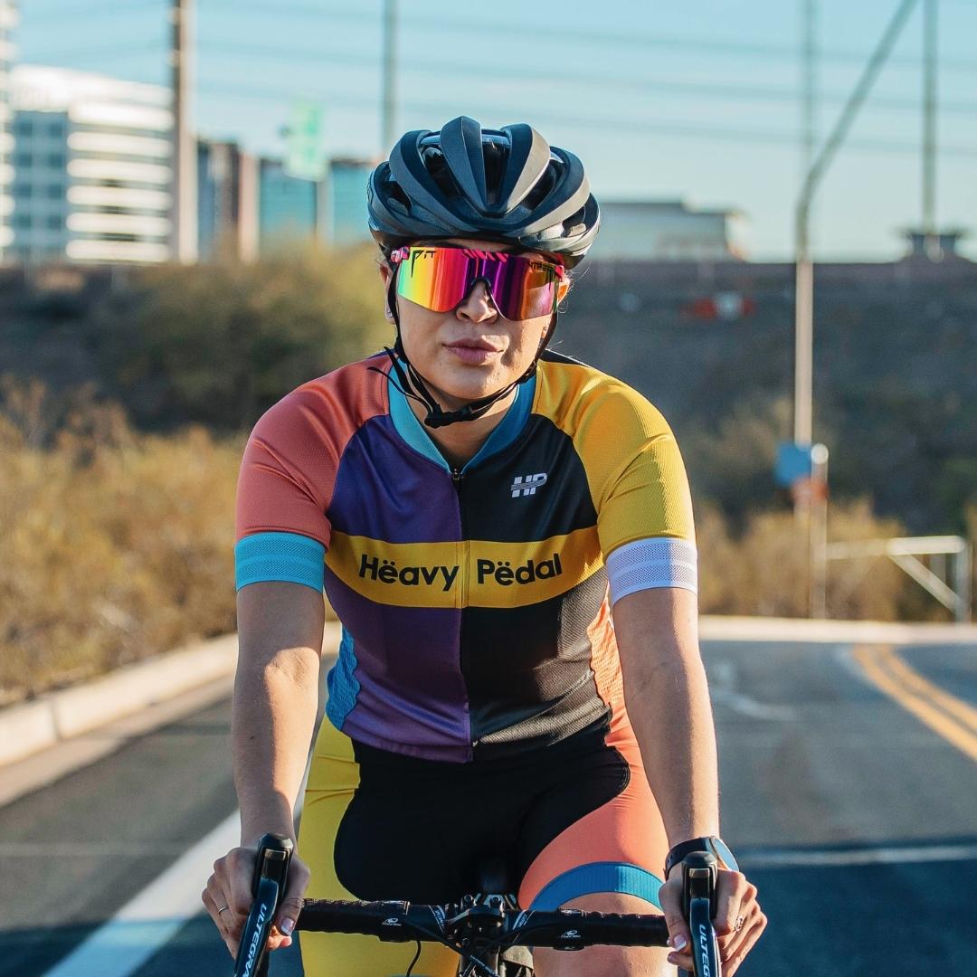 / Polarized Rainbow | Woman riding a bike wearing Pit Viper Sunglasses