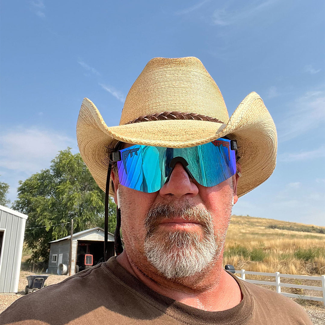 Wide / Polarized Blue | Man wearing a cowboy hat and The Peacekeeper Original from Pit Viper Sunglasses