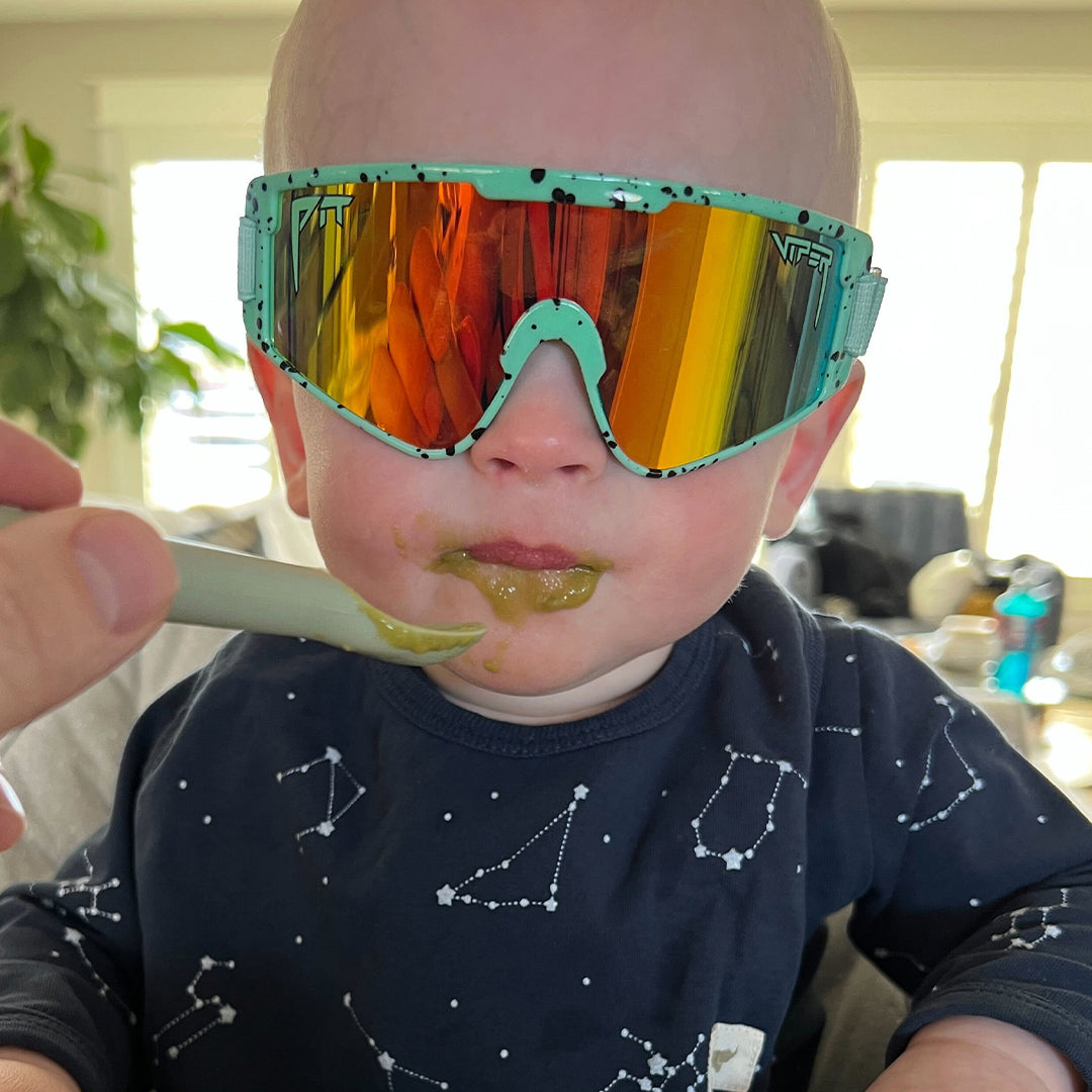 / Rainbow | Baby being fed in The Poseidon Baby Vipes from Pit Viper Sunglasses