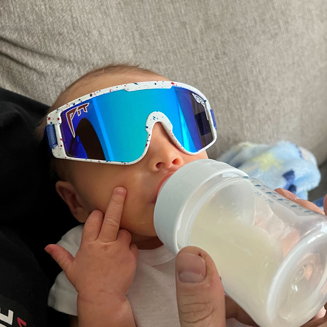 / Blue | Baby drinking milk wearing The Merika Baby Vipes from Pit Viper Sunglasses