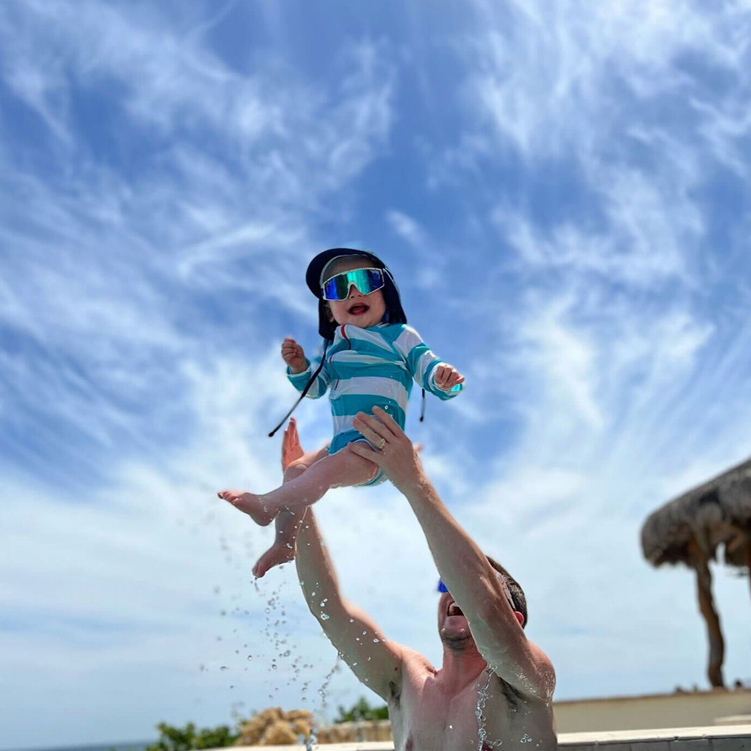 / Blue | Baby in a pool wearing The Merika Baby Vipes from Pit Viper Sunglasses