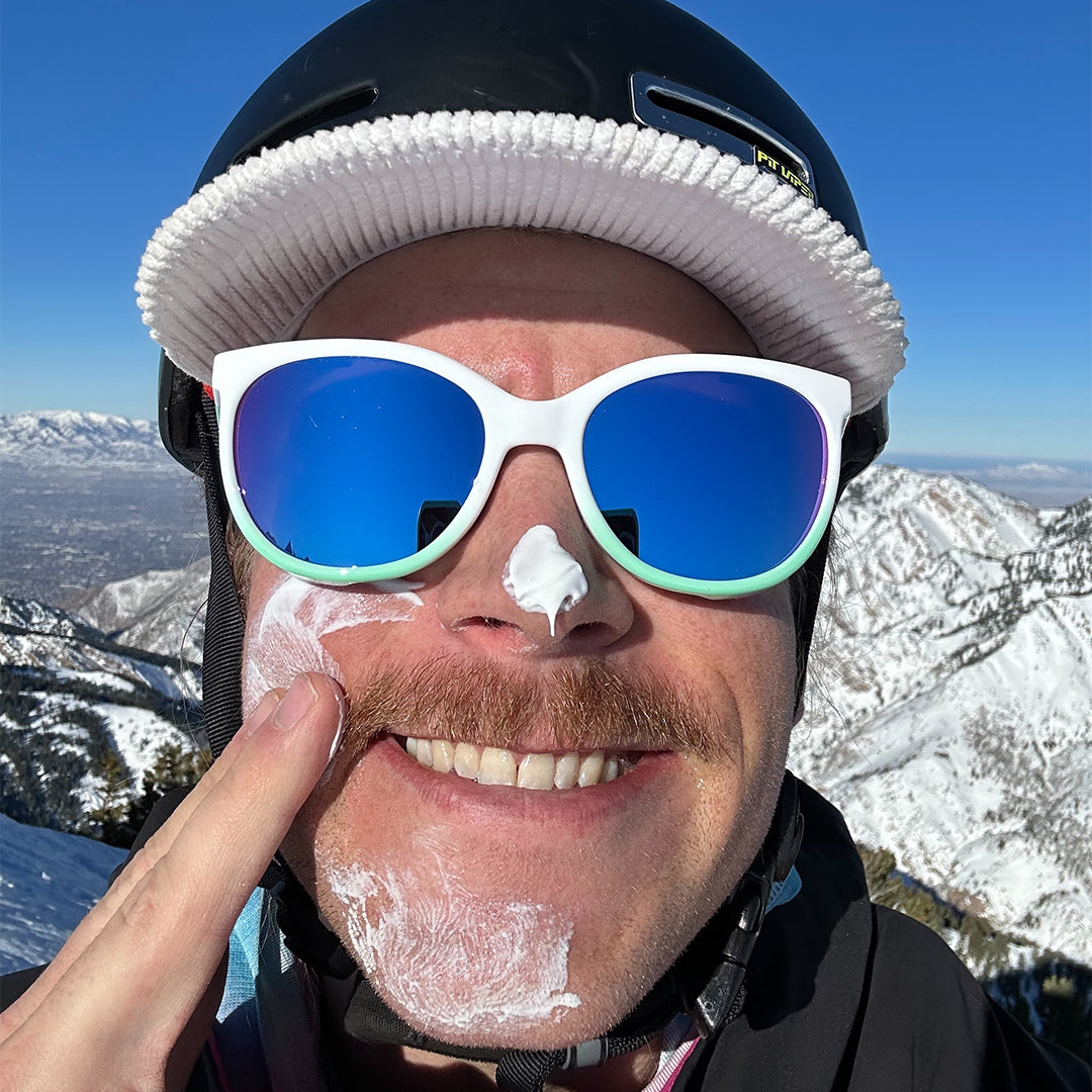 / Blue-Purple | Man putting sun screen on wearing Pit Viper Sunglasses