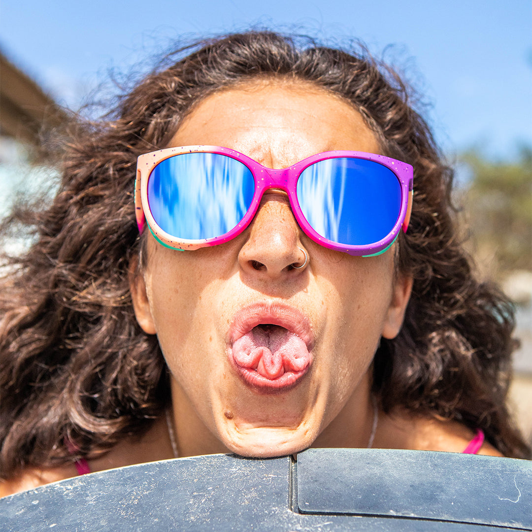 / Blue-Purple | Woman folding her tounge wearing Pit Viper Sunglasses