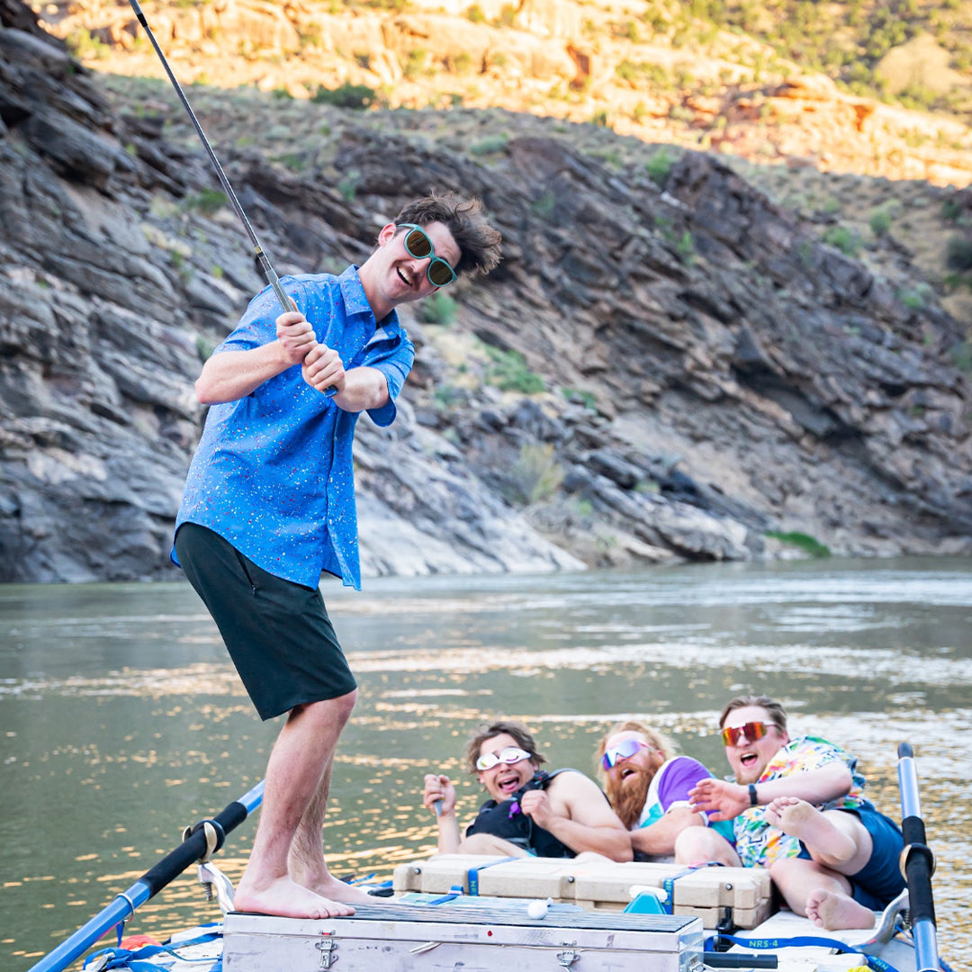 / Gold | Man pretending to golf on a raft wearing Pit Viper Sunglasses