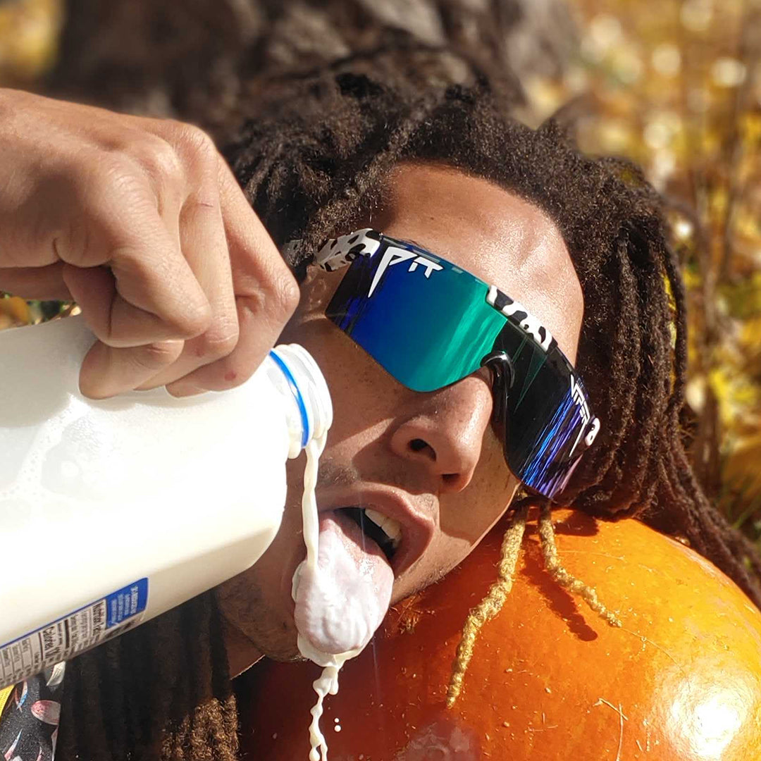 / Polarized Blue-Green | Man waterfalling milk into his mouth wearing Pit Viper Sunglasses