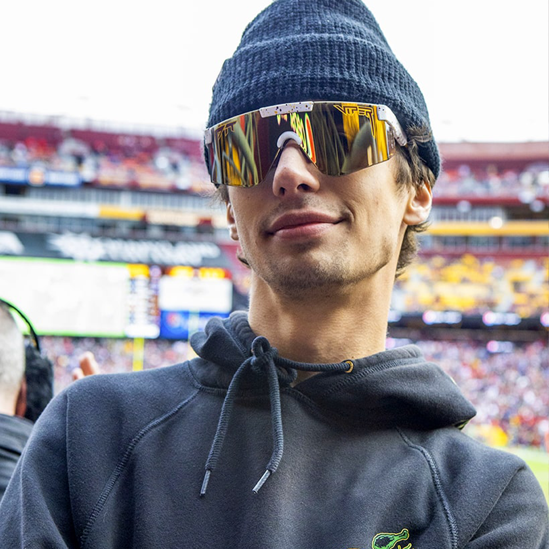 / Z87+ Gold | Man smiling at a football game wearing Pit Viper Sunglasses