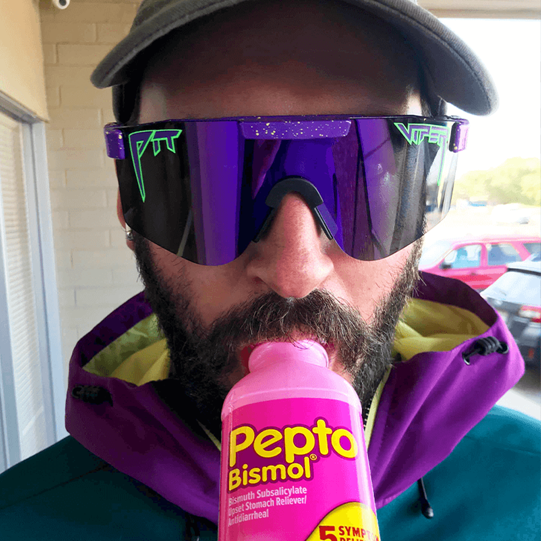 Wide / Polarized Purple | Man drinking pepto bismol wearing The Donatello Original from Pit Viper Sunglasses