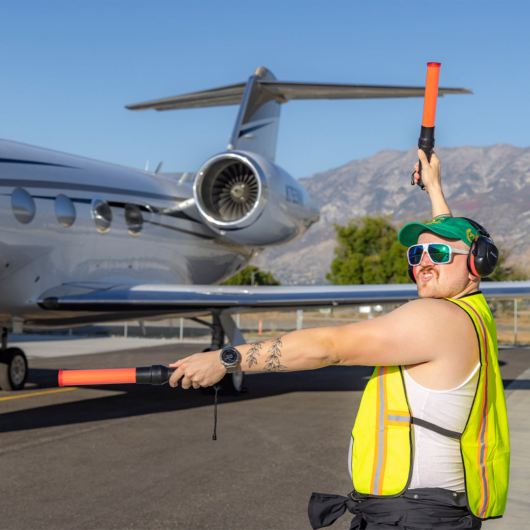 / Blue-Green | A man posing as an air traffic controller wearing Pit Viper Sunglasses