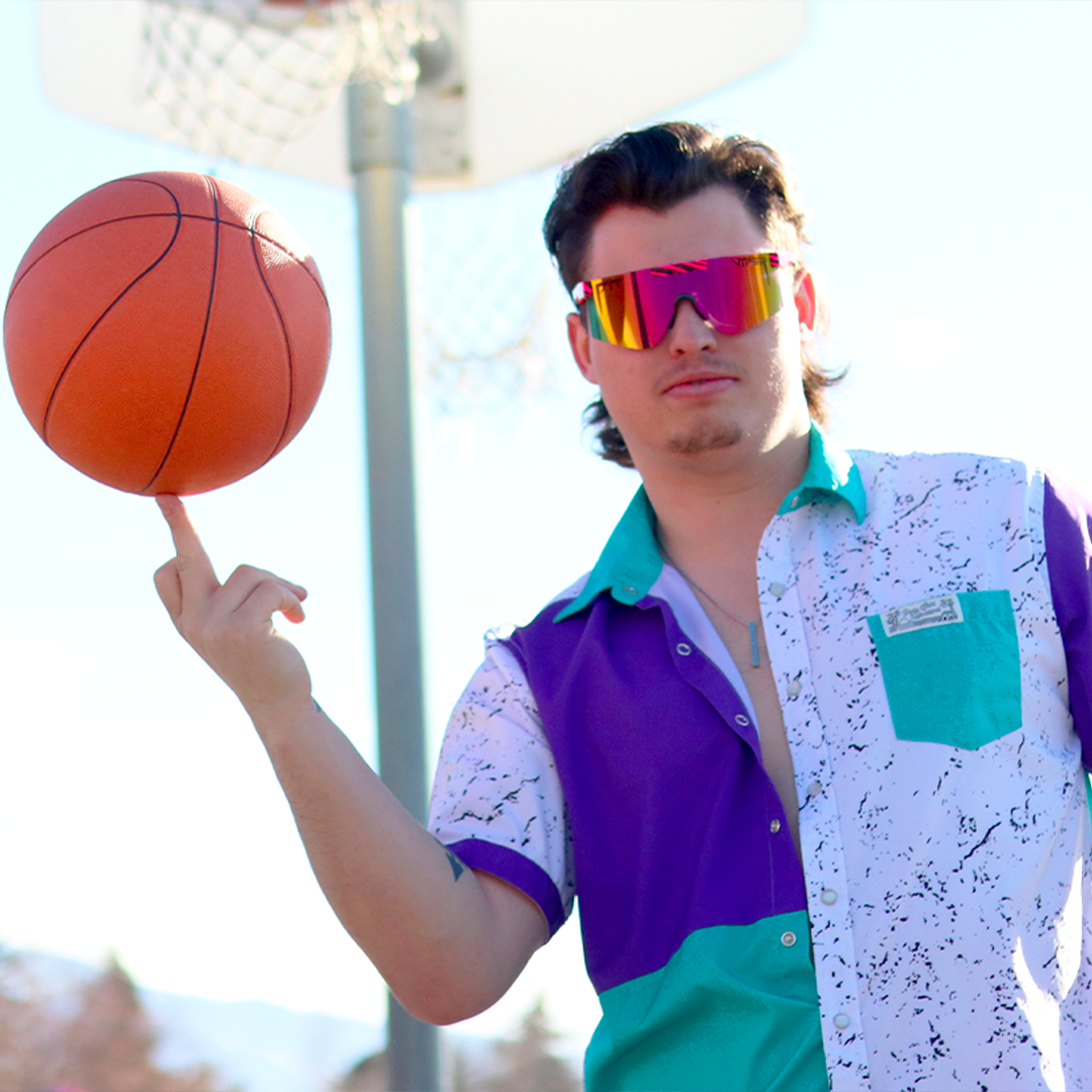 / Polarized Rainbow | Man twirling a basketball wearing Pit Viper Sunglasses