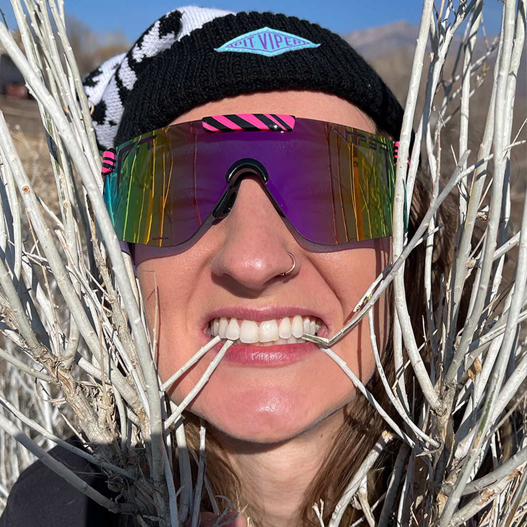 / Photochromic Rainbow | Woman biting a tree wearing Pit Viper Sunglasses