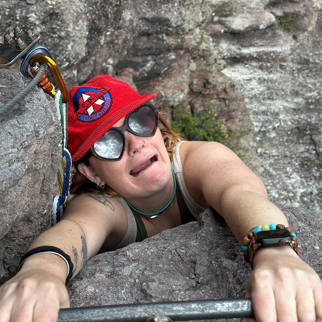 / Brown | Woman rock climbing in The Landlocked Admirer from Pit Viper Sunglasses