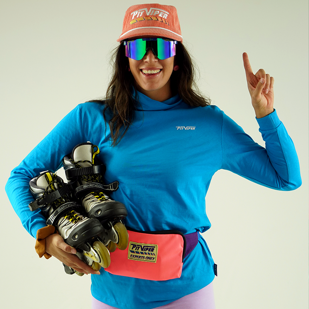 / Z87+ Blue-Green | Woman holding roller blades wearing Pit Viper Sunglasses