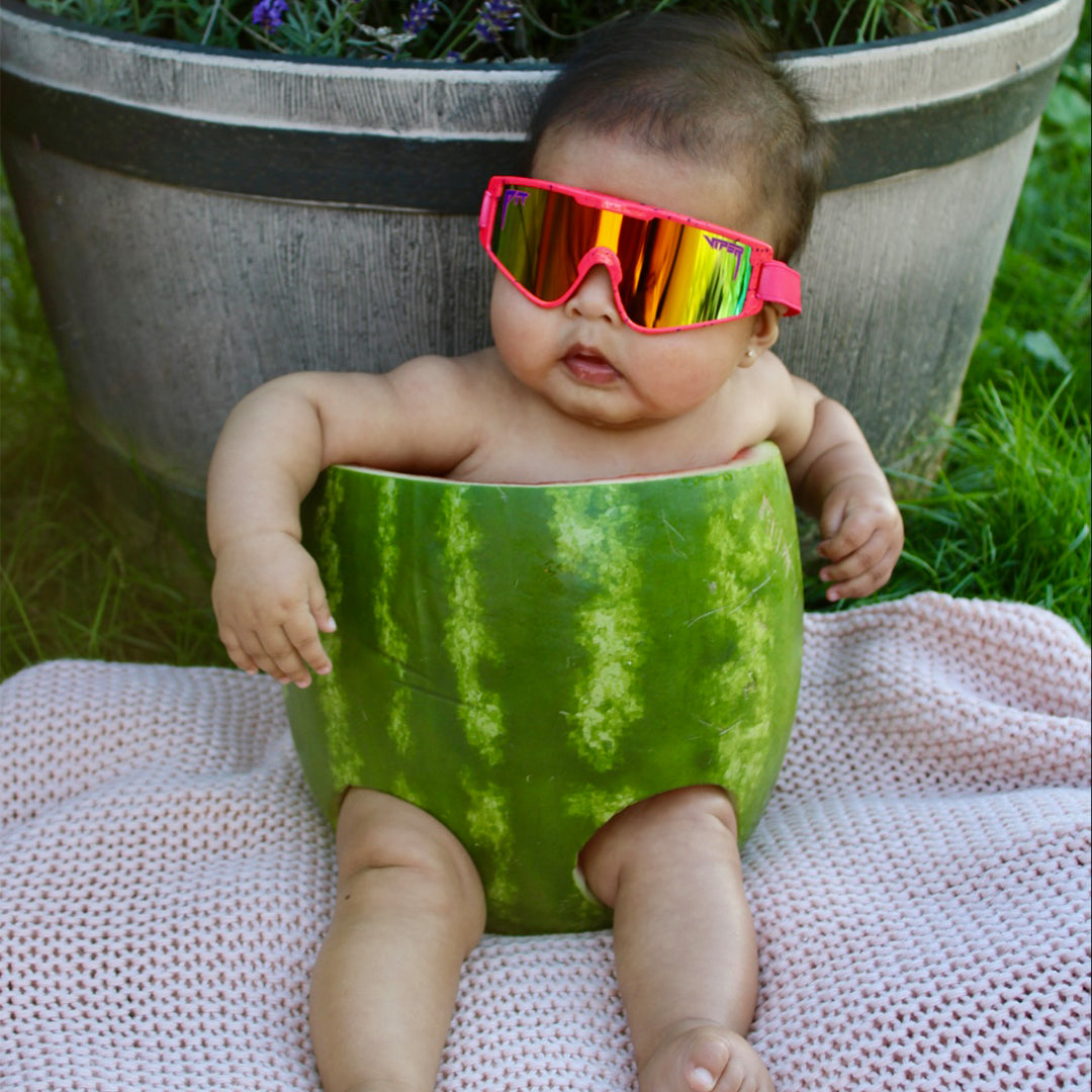 / Rainbow | Baby in a watermelon wearing The Radical Baby Vipes from Pit Viper Sunglasses