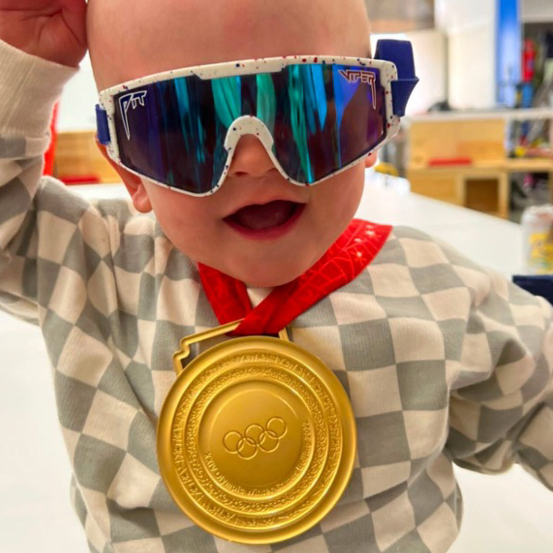 / Blue | Baby wearing an Olympic gold medal wearing The Merika Baby Vipes from Pit Viper Sunglasses