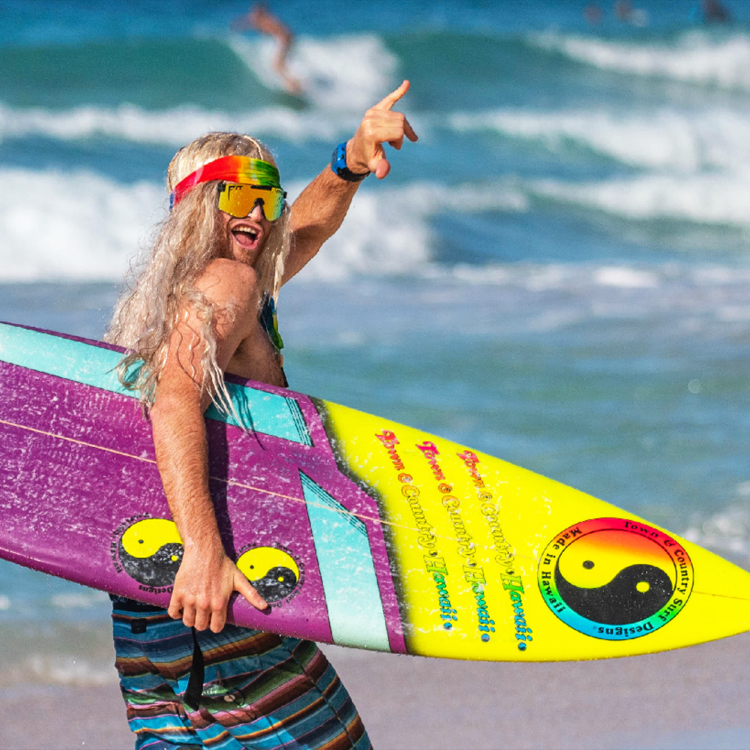 Wide / Polarized Orange | Man holding a surfboard wearing The Monsterbull Original from Pit Viper Sunglasses