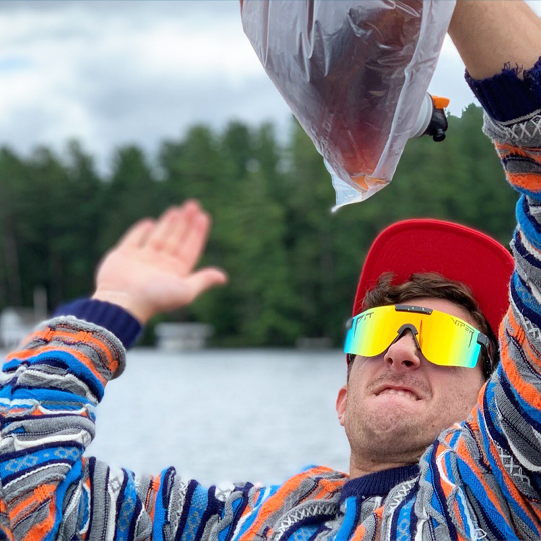 Wide / Polarized Orange | Man slapping a wine bag wearing The Monsterbull Original from Pit Viper Sunglasses