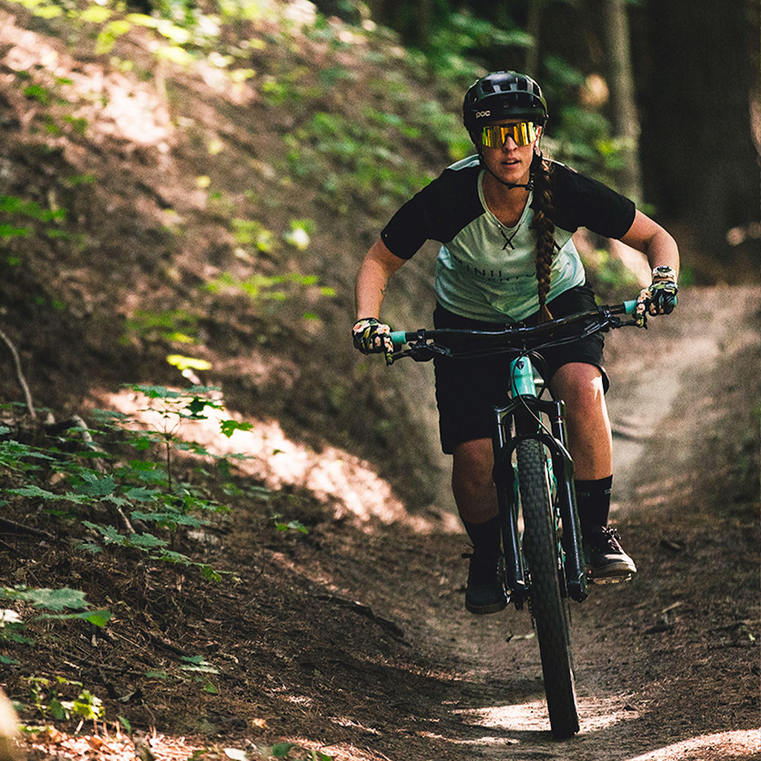 Narrow / Polarized Orange | Woman riding a mountain bike wearing The Monsterbull Original from Pit Viper Sunglasses