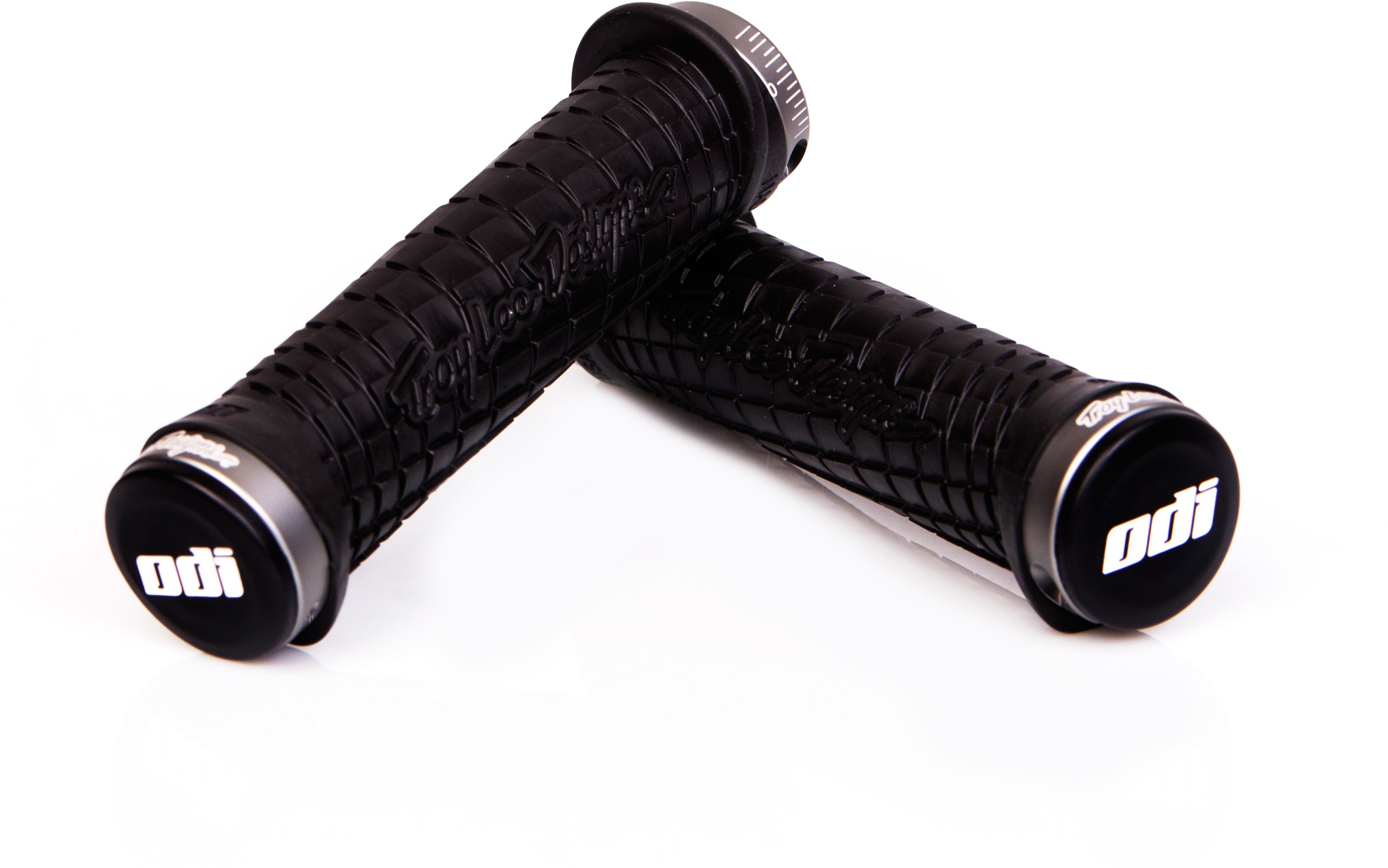 Troy Lee Designs Lock On Grips 130mm displayed on a white background, showcasing their textured surface and ergonomic design for enhanced grip on bike handlebars.