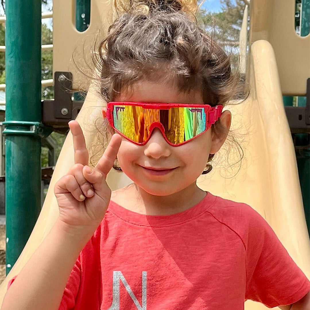 / Rainbow | Toddler holding up the peace sign wearing The Radical Baby Vipes from Pit Viper Sunglasses