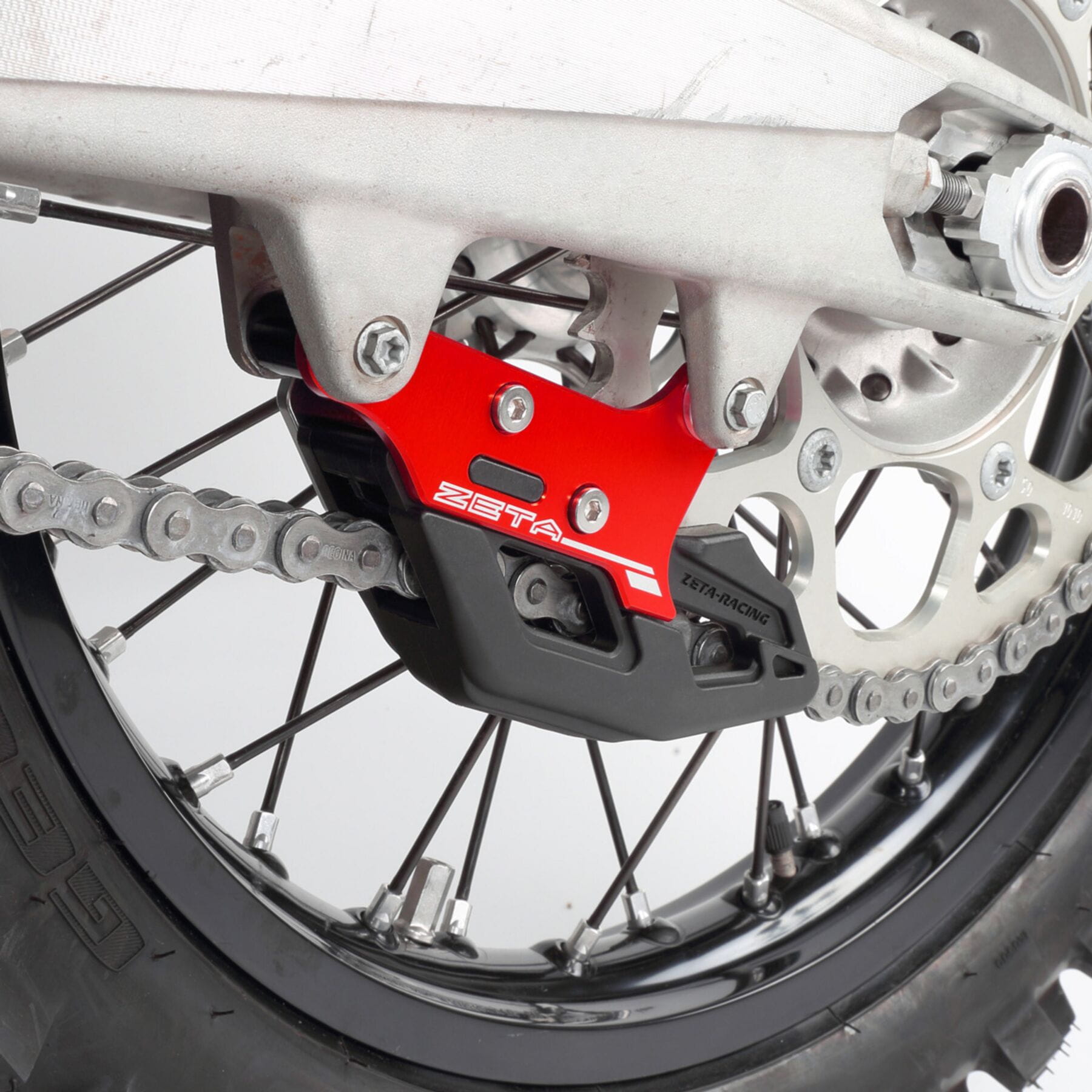 Chain Guide GAS GAS MC/EX/EC'21- Red mounted on a motorcycle, showcasing its vibrant red color and sturdy design for optimal chain protection.